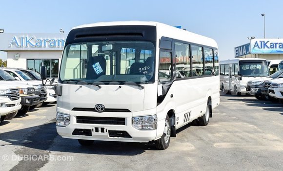 Acheter Import Voiture Toyota Coaster Blanc à Import - Dubai, East Mahé Acheter Import Voiture Toyota Coaster Blanc à Import - Dubai, East Mahé