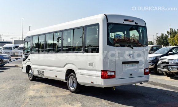 Acheter Import Voiture Toyota Coaster Blanc à Import - Dubai, East Mahé Acheter Import Voiture Toyota Coaster Blanc à Import - Dubai, East Mahé
